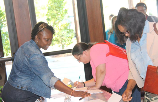 Conference attendees sign in to enter the Partners in Care Summit in Prattville