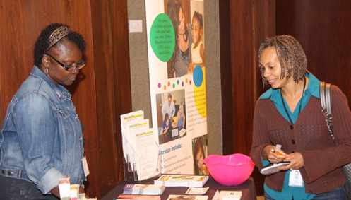 The Children’s Rehabilitation Service exhibit table provides information to attendees about various services provided through the program